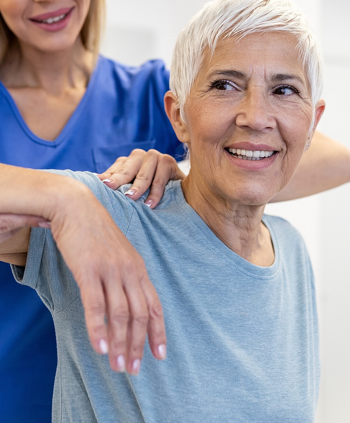 Healthcare professional giving Lancaster Shoulder Pain Treatment to elderly patient.